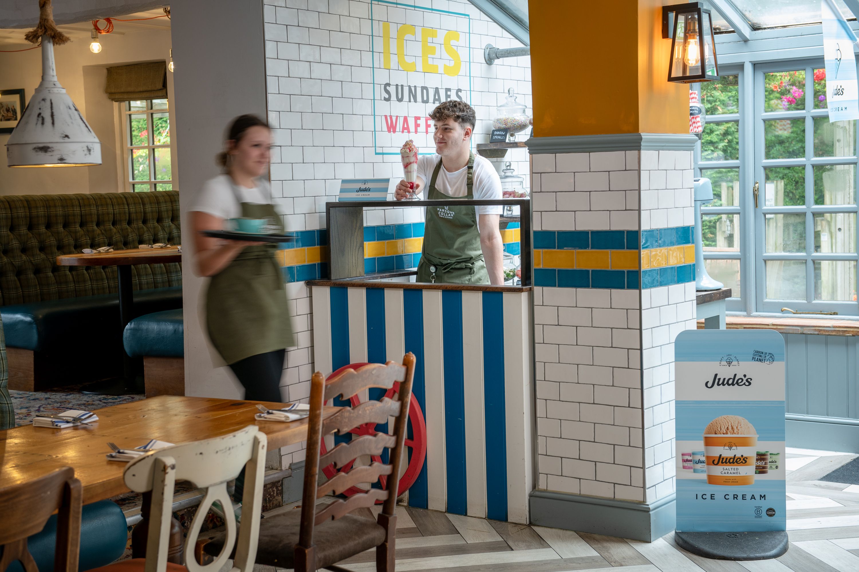 Man serving ice cream sundae