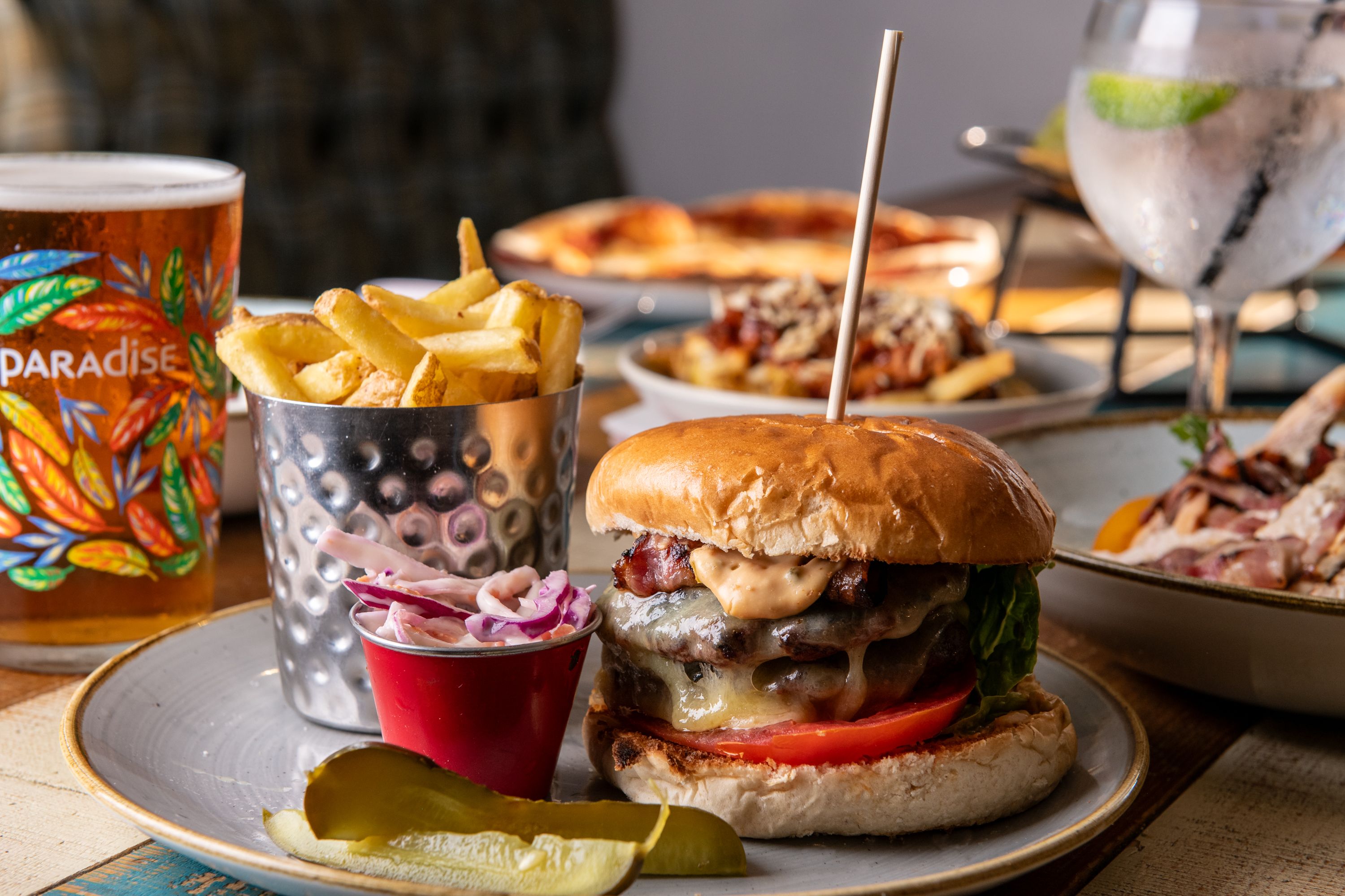 Cheese burger and chips mean with a pint paradise